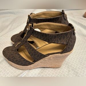 Like new monogram Micheal Kors Wedges size 9.